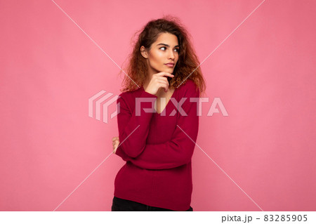 Photo of young european thoughtful charming cute brunette curly woman with sincere emotions wearing Photo of young european thoughtful charming cute brunette curly woman with sincere emotions wearing 83285905