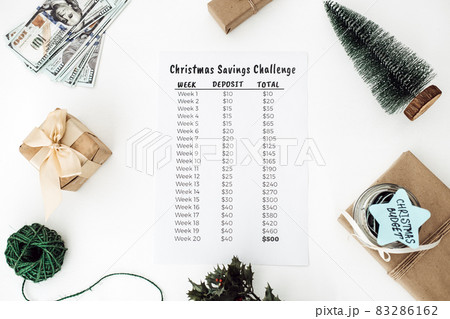 Christmas budget, Christmas Savings Challenge. Xmas savings, Savings challenge, Saving money concept with dollars bills and Savings Challenge list Christmas budget, Christmas Savings Challenge. Xmas savings, Savings challenge, Saving money concept with dollars bills and Savings Challenge list 83286162