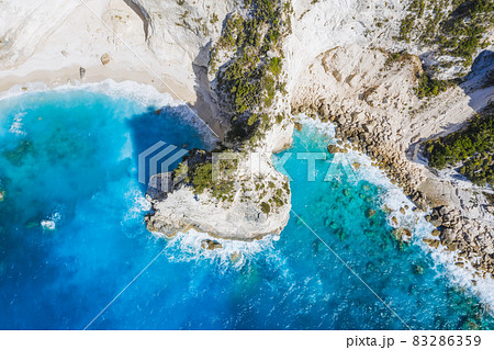 Top down aerial view of Kalamitsi rocky beach, Ionian Sea, Lefkada island, Greece Top down aerial view of Kalamitsi rocky beach, Ionian Sea, Lefkada island, Greece 83286359