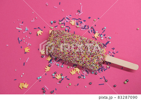 Ice cream on stick with colorful sprinkles 83287090