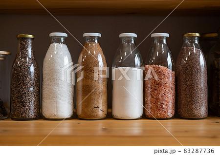 Glass jars with cereals in an eco friendly store. The concept of a grocery store without plastic disposable packaging 83287736