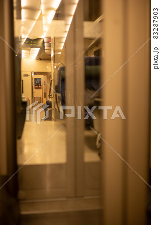 Legs of a man who is sitting relaxed in the train Legs of a man who is sitting relaxed in the train 83287903