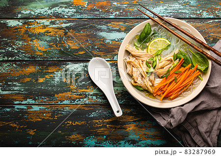Asian soup with noodles in bowl top view copy space 83287969