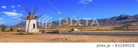 desert scenery with windmill. Fuerteventura island. Canary islands of Spain 83289029