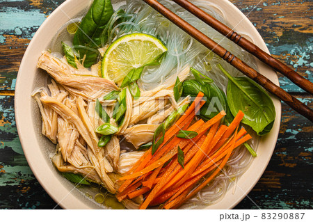 Asian soup with noodles in bowl top view 83290887