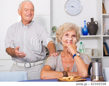 Elderly man trying to apologize to offended woman Elderly man trying to apologize to offended woman 83300506