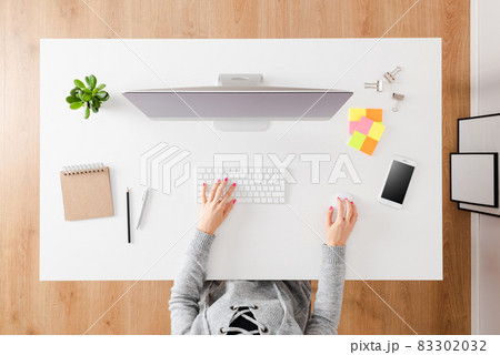 Woman working on computer. Top view 83302032