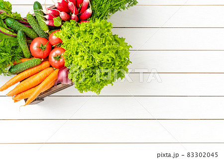 Overhead shot of vegetables in wooden box Overhead shot of vegetables in wooden box 83302045