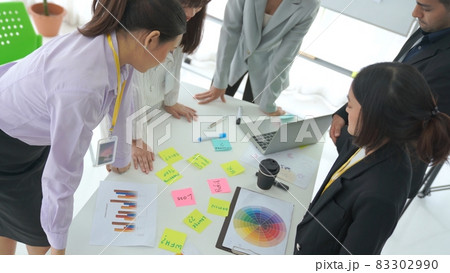 Business people proficiently discuss work project on meeting table 83302990