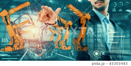 Mechanized industry robot arm and factory worker double exposure 83303483