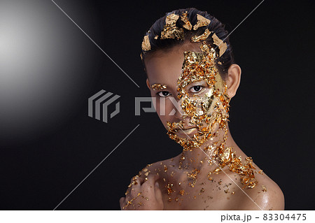 Gold Leaf High fashion style on Asian Woman Face dark mystery look Gold Leaf High fashion style on Asian Woman Face dark mystery look 83304475