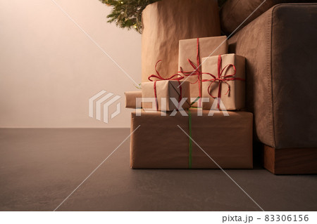 gift boxes under christmas tree with warm light gift boxes under christmas tree with warm light 83306156