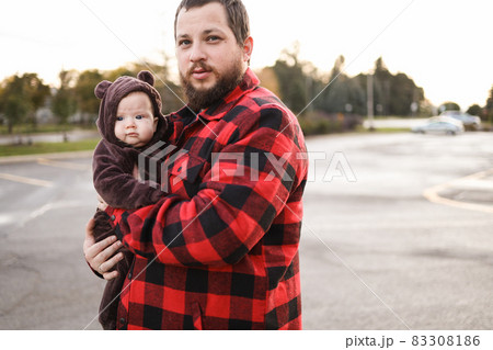 Caucasian father holding little baby kid outdoors. 83308186