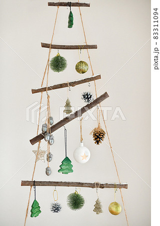 Handmade wooden Christmas tree hanging on the wall 83311094