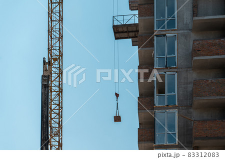 construction of new modern skyscraper or living building in big city 83312083