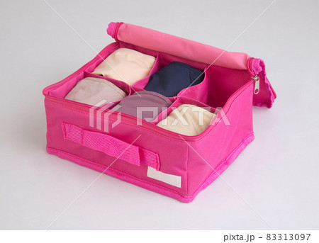 Fabric pink box for separate storage of underwear isolated on white Fabric pink box for separate storage of underwear isolated on white 83313097