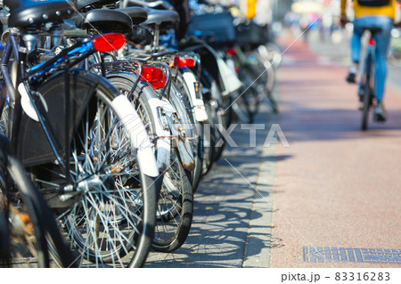 Bicycle parking. Creative background. Selective focus and beautiful bokeh background. Amsterdam, Holland, Europe 83316283