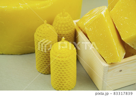 large pieces of natural beeswax, close-up, raw materials for candles. 83317839