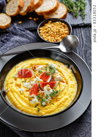 Pumpkin cream soup with thyme with feta and figs Pumpkin cream soup with thyme with feta and figs 83318052