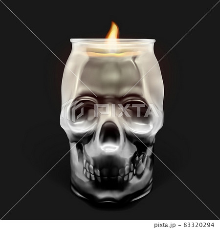 Glass transparent skull with a candle inside. 83320294