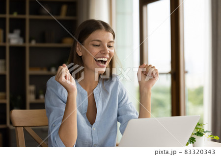 Happy young millennial girl excited with great news, win, success Happy young millennial girl excited with great news, win, success 83320343