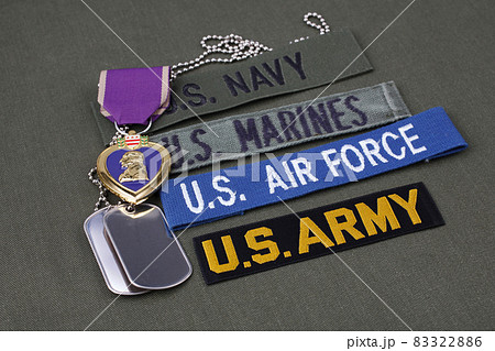 US military veteran concept with Purple Heart award on olive green uniform US military veteran concept with Purple Heart award on olive green uniform 83322886