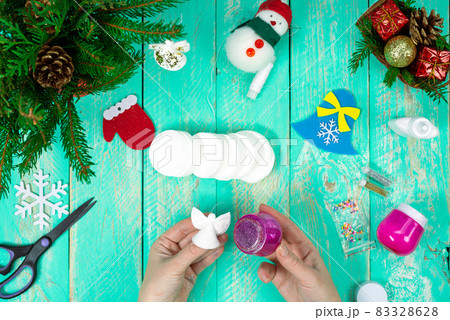Create a children's Christmas gift with a little angel toy made of cotton pads. Children's art project, handicrafts, handicrafts for children. Step-by-step instruction. Step 14 Create a children's Christmas gift with a little angel toy made of cotton pads. Children's art project, handicrafts, handicrafts for children. Step-by-step instruction. Step 14 83328628
