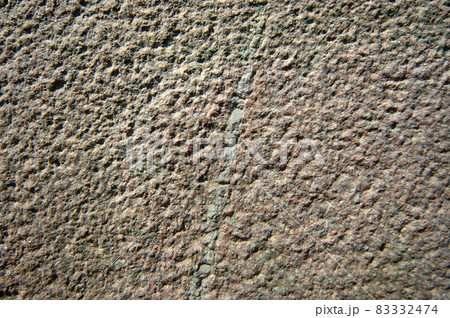 Brown, textured, marble or granite wall background. 83332474