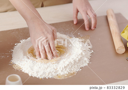 Woman Mixing Dry and Liquid Ingredeints 83332829