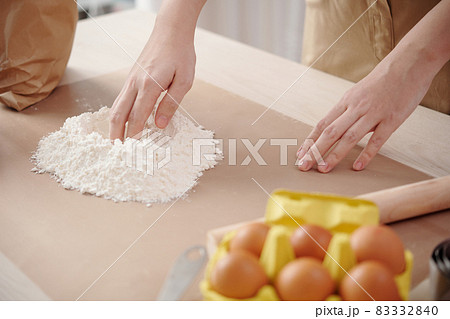 Woman Mixing Egg and Flour Woman Mixing Egg and Flour 83332840