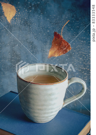 Autumn leaves, tea, and books on a rainy day Autumn leaves, tea, and books on a rainy day 83333548
