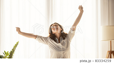 woman enjoying sunny morning woman enjoying sunny morning 83334259