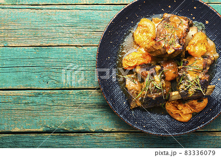 Beef ribs in apricots 83336079