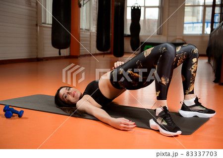 Young pretty woman training in gym. Heathy lifestyle, sport conception. Young pretty woman training in gym. Heathy lifestyle, sport conception. 83337703