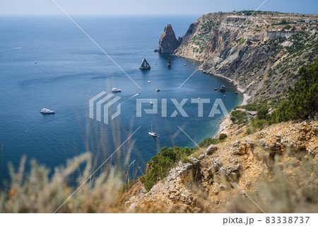 Fiolent , Crimea - sea landscape. Sea view - Mountains surround the bay and the small pleasure yacht boats moored in the lagoon 83338737