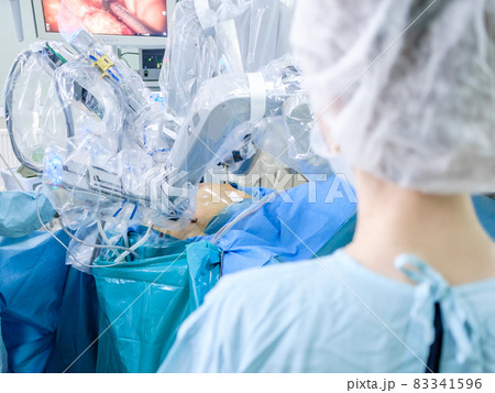 The process of carrying out a surgical operation using a modern robotic surgical system. Medical robot. The process of carrying out a surgical operation using a modern robotic surgical system. Medical robot. 83341596