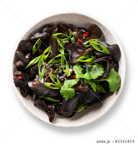 Chinese pickled tree black muer mushrooms in bowl on white background. Chinese pickled tree black muer mushrooms in bowl on white background. 83342854