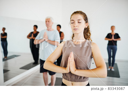 People meditating in gym class People meditating in gym class 83343087