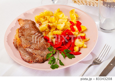 Beef entrecote with fried potato and baked sweet pepper 83343208