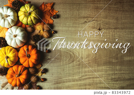 Happy Thanksgiving Day with pumpkin and nut on wooden table 83343972