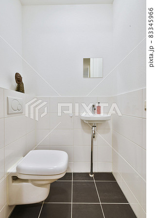 Bright bathroom interior with faucet and toilet 83345966