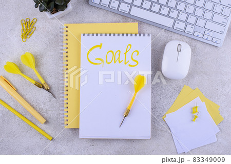 Target and goal concept with arrows and notebook 83349009