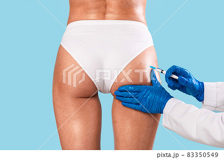 Woman having butt lifting treatment at beauty salon Woman having butt lifting treatment at beauty salon 83350549