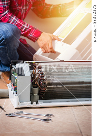 repairing the air conditioner repairing the air conditioner 83352375