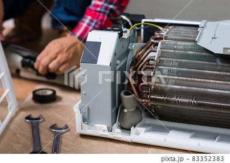 repairing the air conditioner repairing the air conditioner 83352383
