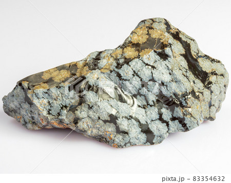 Mineral snow obsidian. The stone is of volcanic origin on a white background. Mineral snow obsidian. The stone is of volcanic origin on a white background. 83354632