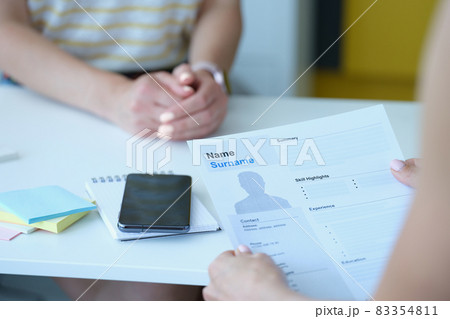 HR manager keeps resume at workplace closeup HR manager keeps resume at workplace closeup 83354811