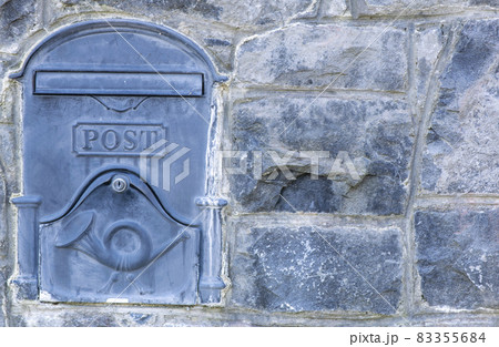 Mailboxes mounted at entry gates, mailboxes embedded in a stone wall, stylish mailboxes. 83355684