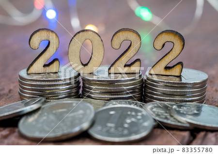 Banner 2022. Coins and Figures 2022. Money stacked in columns. 83355780