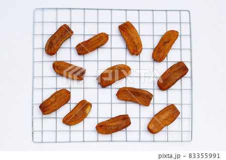 Sun dried bananas on white background. Sun dried bananas on white background. 83355991